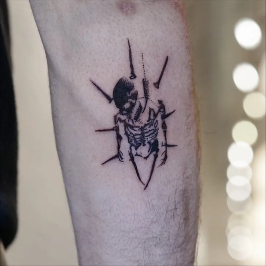 Medium Black and Grey Skull and Spikes Tattoo on Men Arm by @edo.ink9