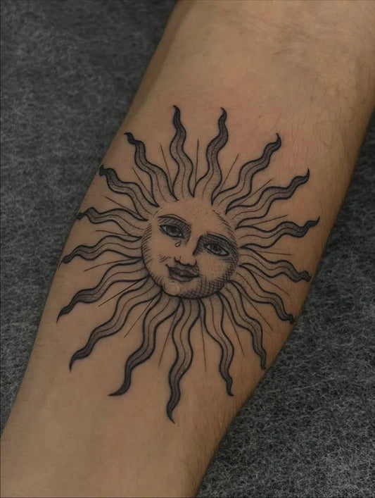 Medium Black and Grey Smiling Sun on Women Arm Tattoo by @mariadeneve.ink