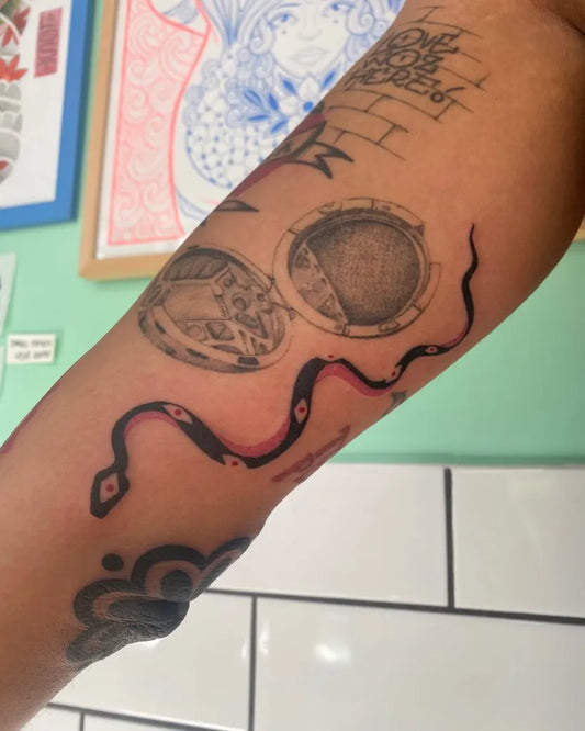 Medium Black and Grey Snake and Coins Women Upper Arm Tattoo on by @poke.evoke