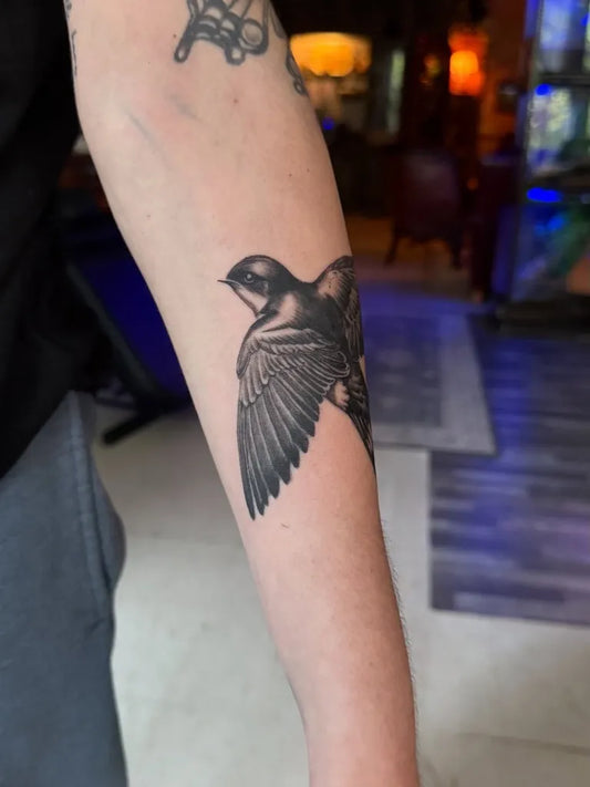 Medium Black and Grey Sparrow Tattoo on Men Arm by @larissa_durante_