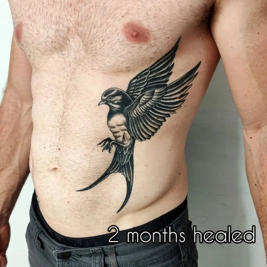 Medium Black and Grey Sparrow Tattoo on Men Torso by @goodall_tattoos