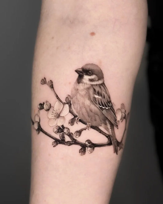 Medium Black and Grey Sparrow and Cherry Blossom Tattoo on Women Arm by @dionne.tattoo