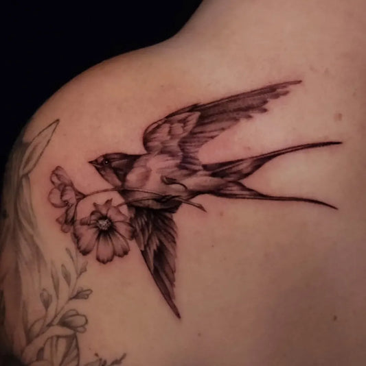 Medium Black and Grey Sparrow and Flowers Tattoo on Women Shoulder by @crystaldawntattoos