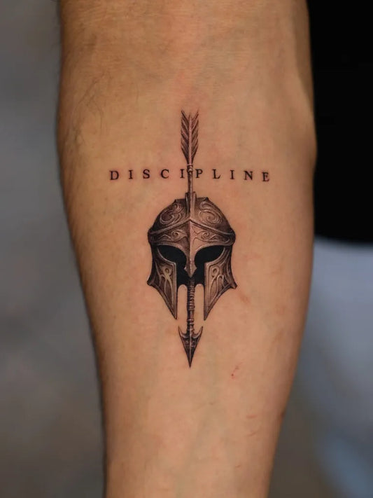 Medium Black and Grey Spartan Helmet with Arrow Tattoo on Men Arm by @d.gone_ttt