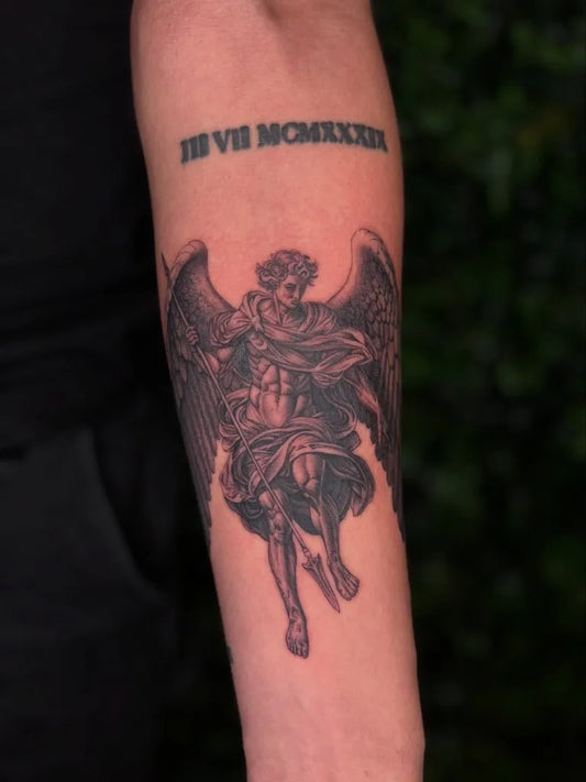 Medium Black and Grey St Michael with Roman Numerals Tattoo on Men Arm by @tattoosbyjaiden