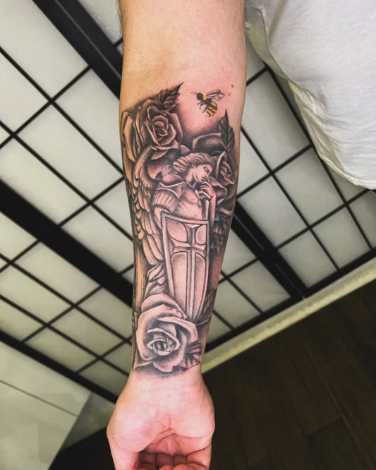 Medium Black and Grey St Michael with Roses and Bee Tattoo on Men Arm by @vickytatts