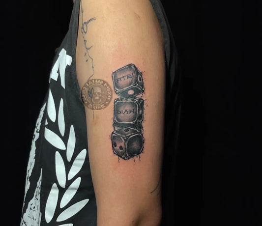 Medium Black and Grey Stacked Dice Tattoo on Women Arm by @wedytattoo_official