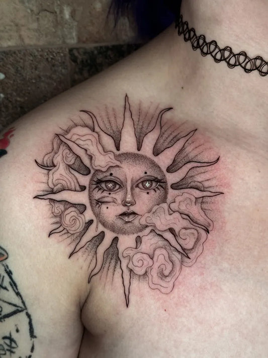 Medium Black and Grey Sun with Face and Clouds on Women Shoulder Tattoo by @melaniestereo