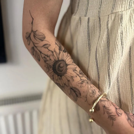 Medium Black and Grey Sunflower and Leaves on Women Arm Tattoo by @amyfloydtattoo
