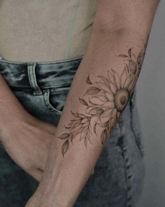Medium Black and Grey Sunflower and Leaves on Women Arm Tattoo by @asya.tattoo