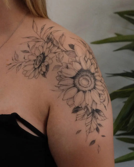 Medium Black and Grey Sunflower and Leaves on Women Shoulder Tattoo by @jimmygalan
