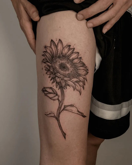 Medium Black and Grey Sunflower on Women Thigh Tattoo by @henrinaves