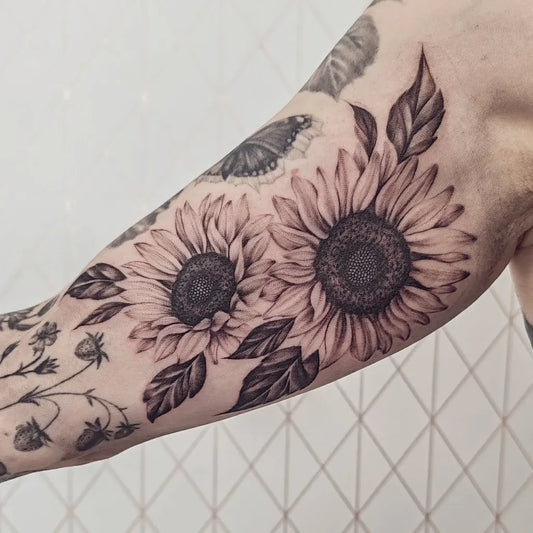 Medium Black and Grey Sunflowers and Butterfly on Women Arm Tattoo by @ellakettunenart