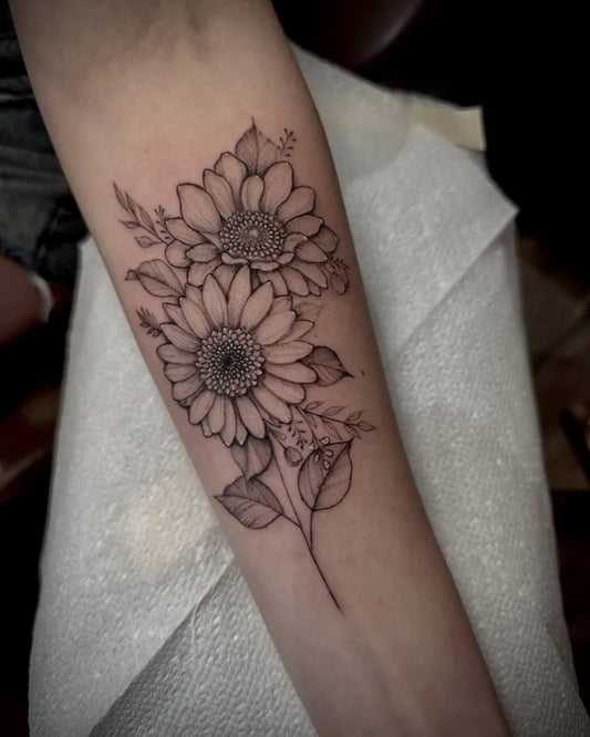 Medium Black and Grey Sunflowers and Leaves on Women Arm Tattoo by @botanicalbodyart