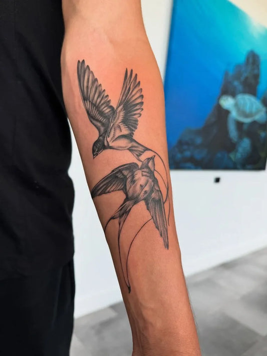 Medium Black and Grey Swallow Birds Tattoo on Men Arm by @charlotte_eaton_tattoo