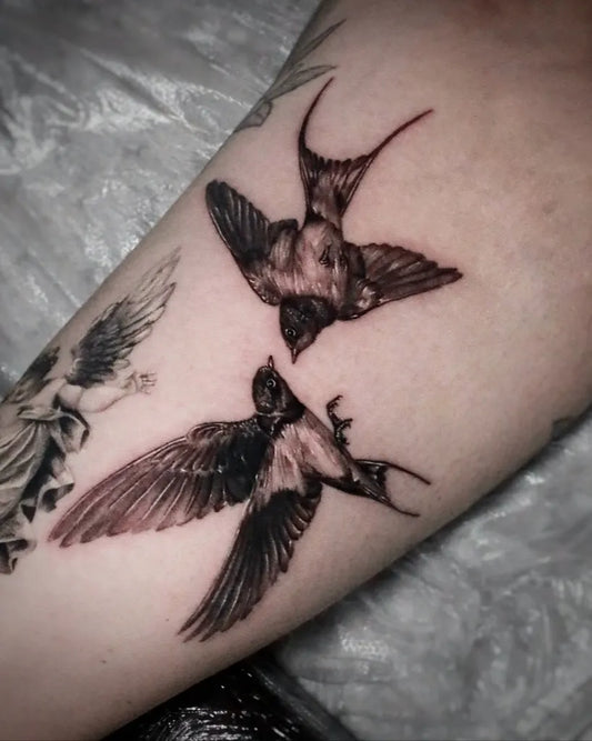 Medium Black and Grey Swallow Birds Tattoo on Women Arm by @hesper_tattoo