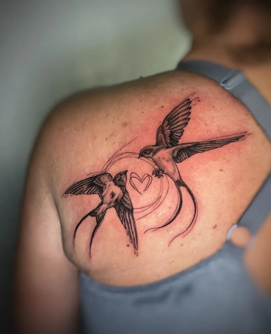 Medium Black and Grey Swallow Heart Tattoo on Women Shoulder by @julia_sokulska