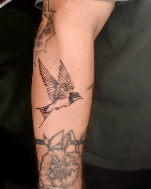 Medium Black and Grey Swallow Tattoo on Men Arm by @bryan.gee