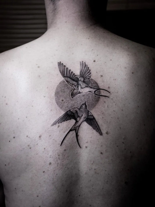Medium Black and Grey Swallow and Sun Tattoo on Men Back by @axelletattoo