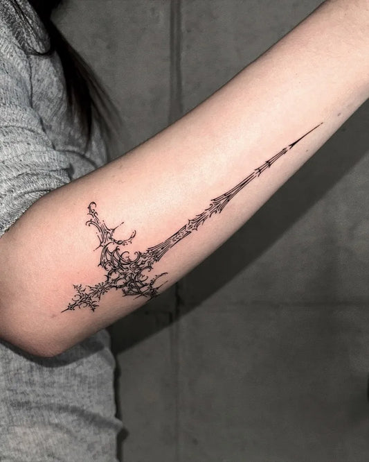 Medium Black and Grey Sword Cross on Women Arm Tattoo by @kamio.ttt