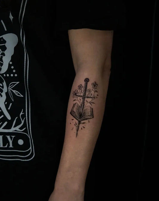 Medium Black and Grey Sword and Book on Men Arm Tattoo by @ssophietattoos