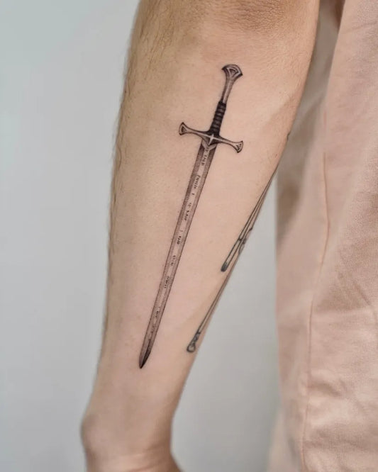 Medium Black and Grey Sword on Men Arm Tattoo by @baronarttattoo