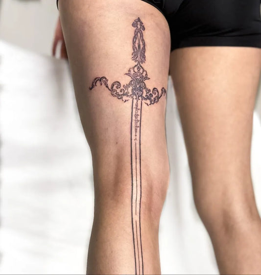 Medium Black and Grey Sword on Women Thigh Tattoo by @peripinktattoo