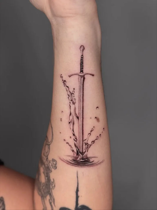 Medium Black and Grey Sword with Broken Chains on Women Forearm Tattoo by @gabi_fenginktattoos