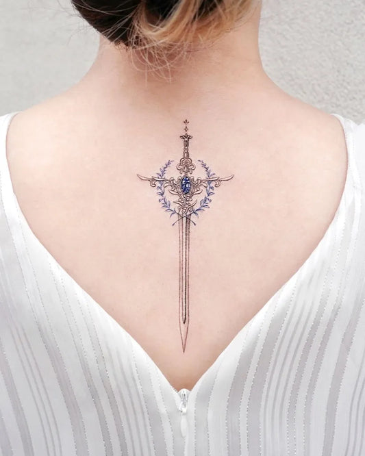 Medium Black and Grey Sword with Laurel Wreath Tattoo on Women Back by @tattooist_solar