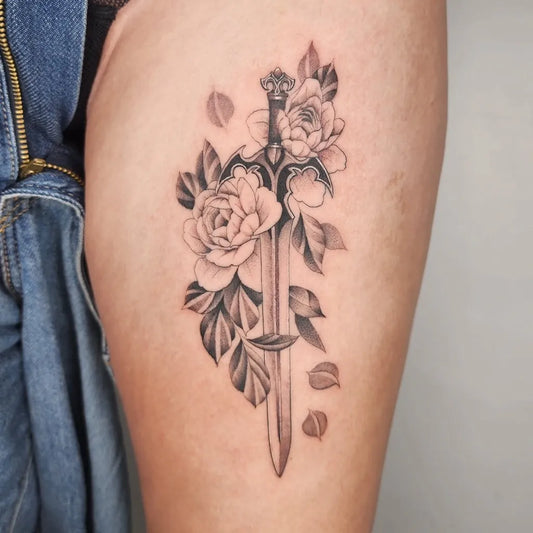 Medium Black and Grey Sword with Roses on Women Thigh Tattoo by @lwoodstattoo