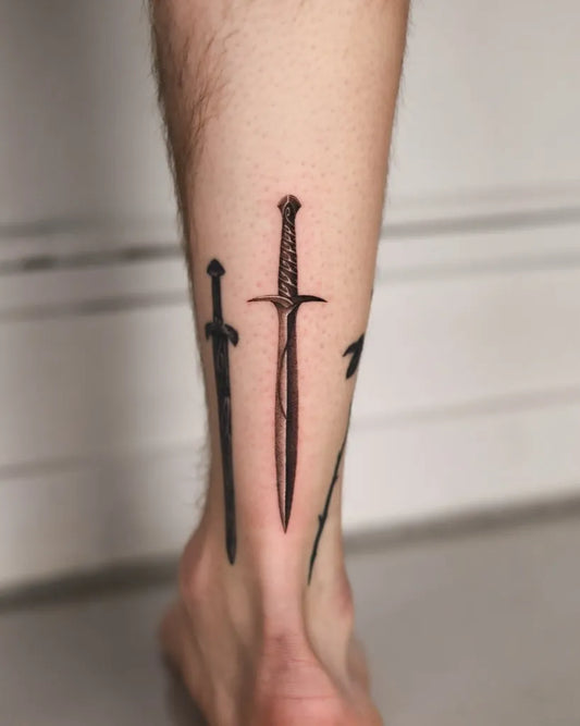 Medium Black and Grey Swords on Men Leg Tattoo by @samslaughtertattoo