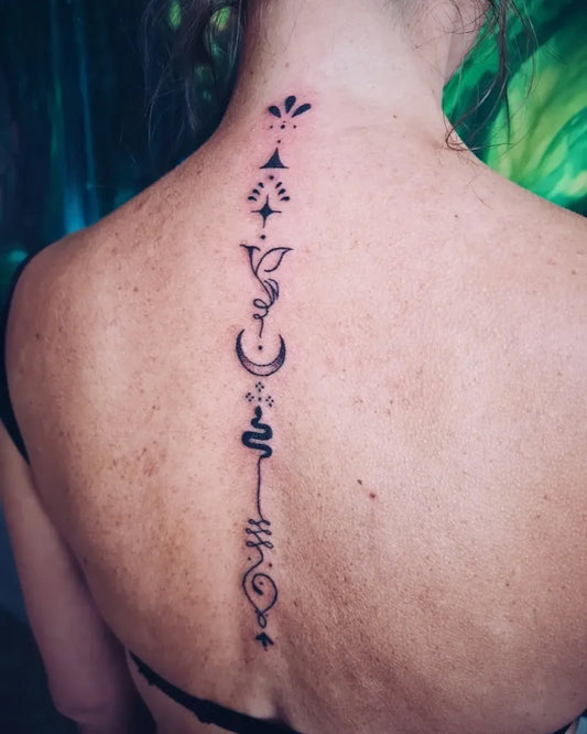 Medium Black and Grey Symbols Spiritual Tattoo on Women Back by @celestial.markings
