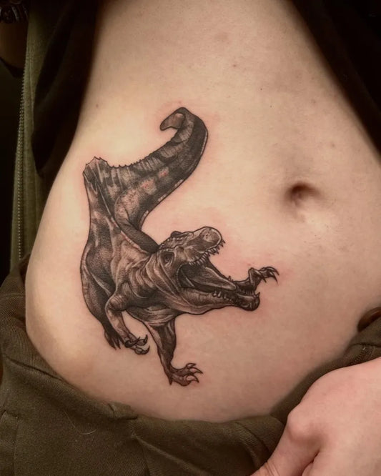 Medium Black and Grey TRex Tattoo on Women Stomach by @tattoosbyemilyfalkowski