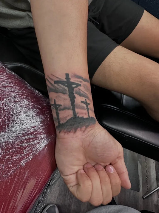 Medium Black and Grey Three Crosses Silhouette Tattoo on Men Wrist by @thevortex