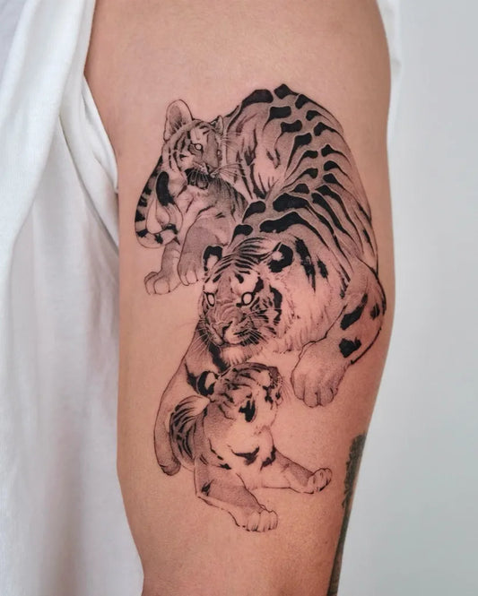 Medium Black and Grey Tiger Cub and Tiger on Men Arm Tattoo by @wilwang_tatt