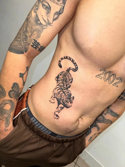 Medium Black and Grey Tiger on Men Side Tattoo by @zerokid_tattoo