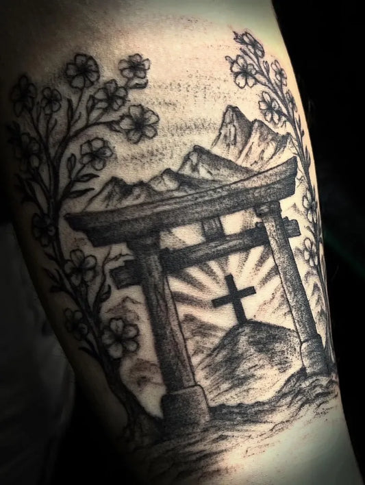 Medium Black and Grey Torii Gate with Mountains and Cross Tattoo on Men Arm by @gray_tattoo_studio