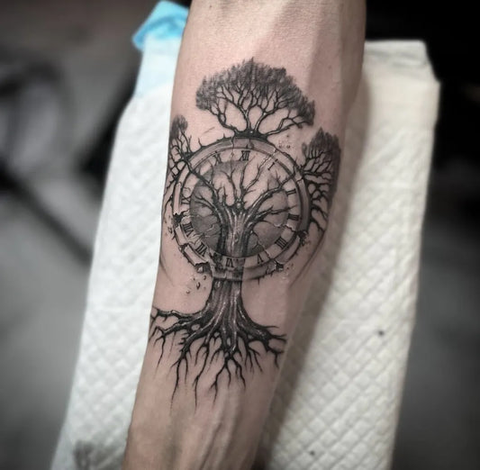 Medium Black and Grey Tree with Clock Tattoo on Men Arm by @onitattootilburg