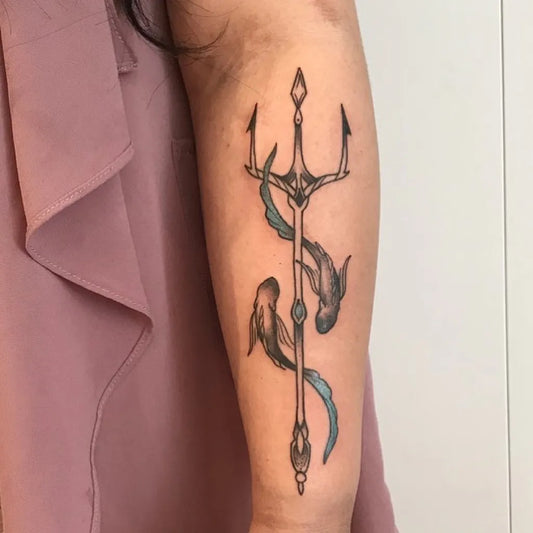 Medium Black and Grey Trident and Pisces Tattoo on Women Arm by @luce.tooth