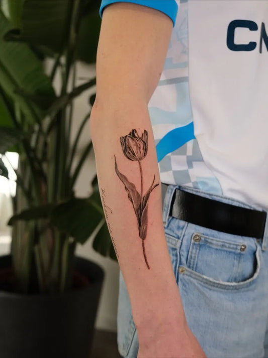 Medium Black and Grey Tulip Tattoo on Men Arm by @jvd_signature