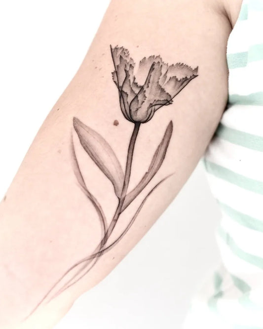 Medium Black and Grey Tulip Tattoo on Women Arm by @eloula.tattoo