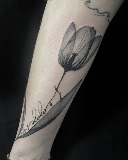 Medium Black and Grey Tulip and Leaf Tattoo on Women Arm by @sailorstattoomilanomoscova