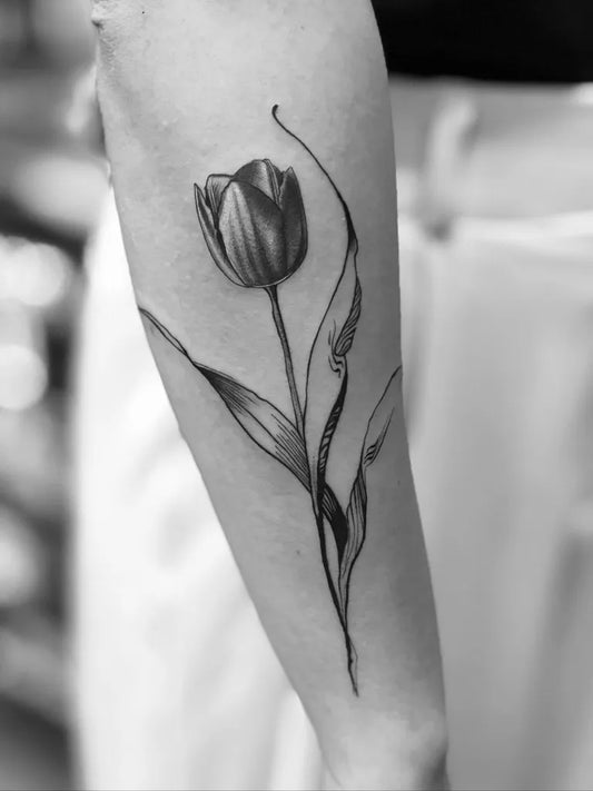 Medium Black and Grey Tulip and Leaves Tattoo on Women Arm by @joseph_dossa_ink