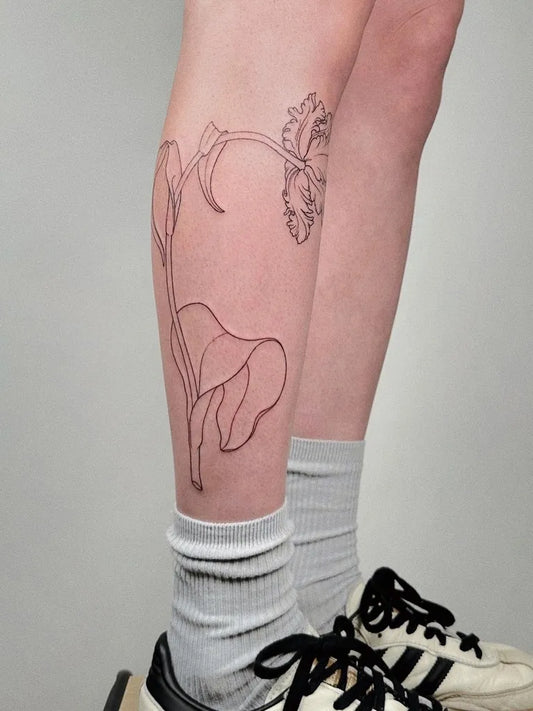 Medium Black and Grey Tulip and Stem Tattoo on Women Leg by @marta_bocharova