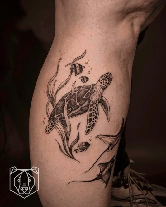 Medium Black and Grey Turtle and Fish Tattoo on Men Leg by @blackbear.ink