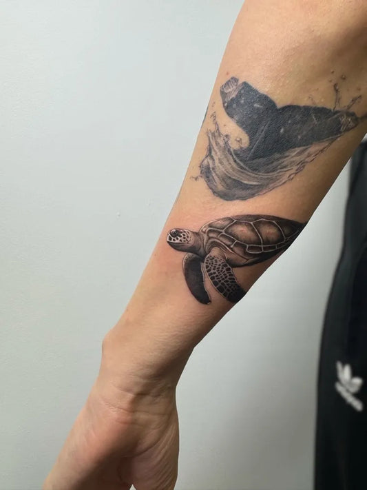 Medium Black and Grey Turtle and Whale Tattoo on Men Arm by @finelinefran