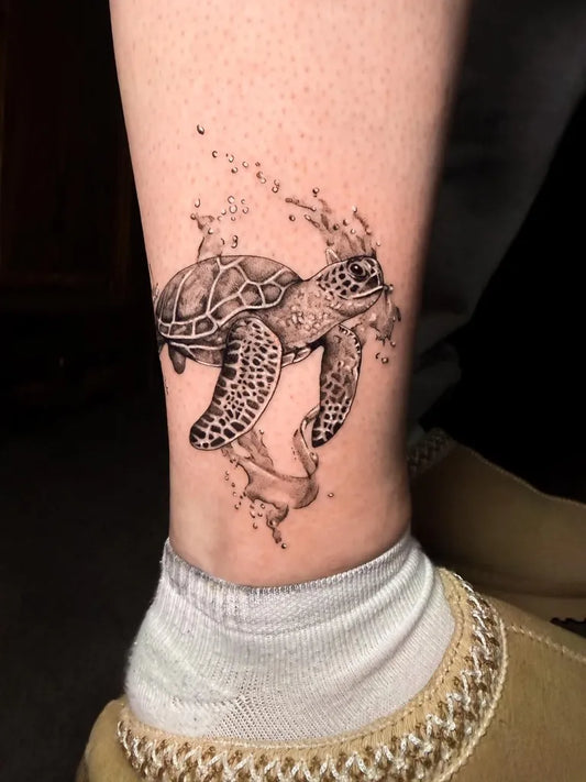 Medium Black and Grey Turtle with Bubbles Tattoo on Women Leg by @inkedbykate_