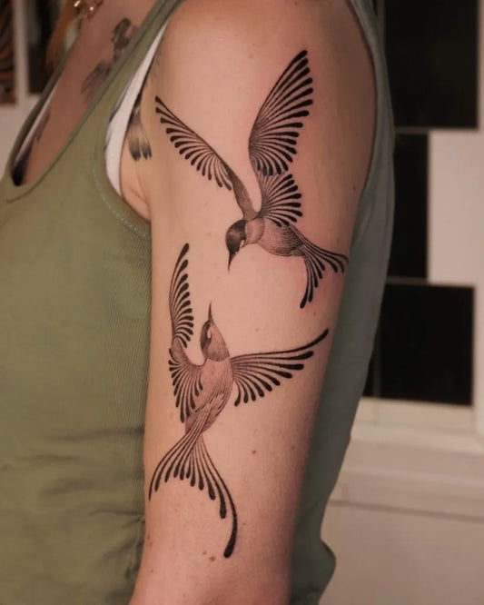 Medium Black and Grey Two Birds Tattoo on Women Arm by @solyn_tattooist