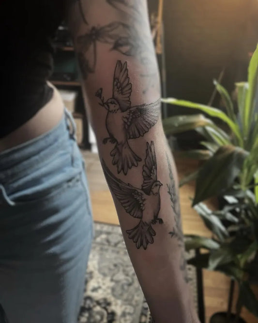 Medium Black and Grey Two Doves Tattoo on Women Arm by @ratedmformorbid