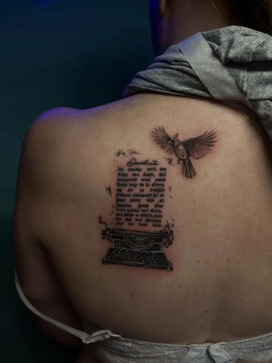 Medium Black and Grey Typewriter with Bird and Text Tattoo on Women Back by @jvl.ink